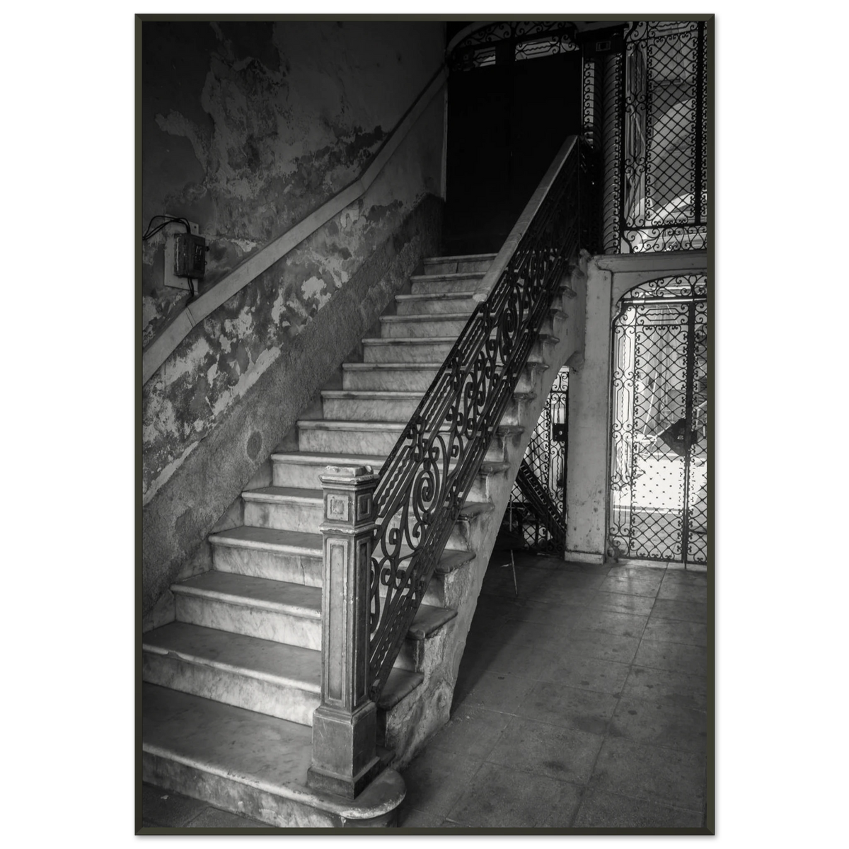 Elegant sweeping staircase inside a historic vintage building in Havana, Cuba - Fine art photography print by Paulo Côrte-Real