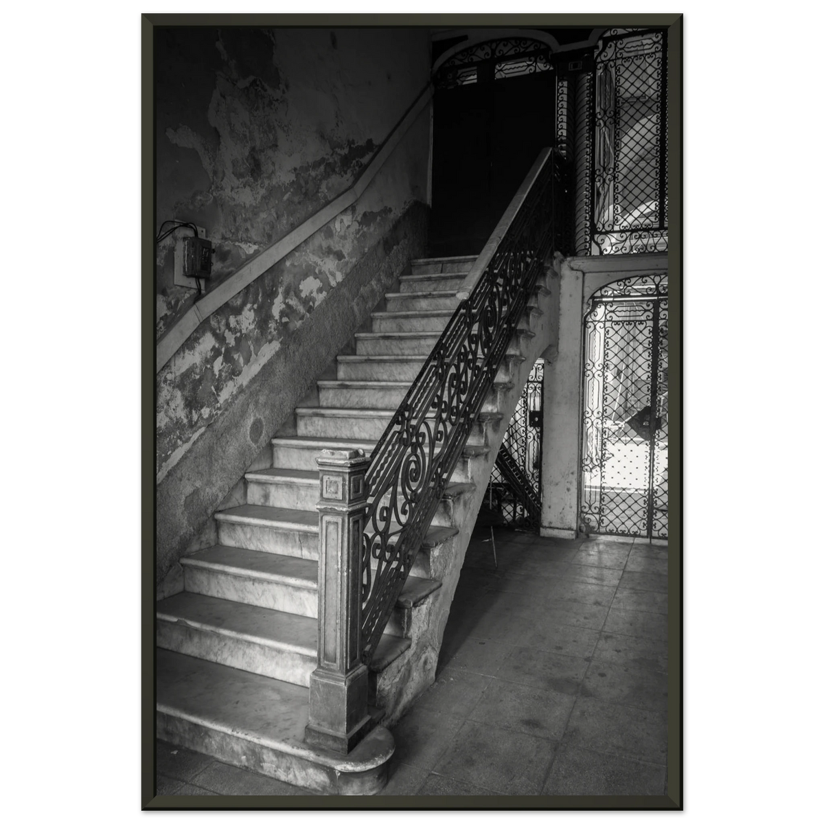 Elegant sweeping staircase inside a historic vintage building in Havana, Cuba - Fine art photography print by Paulo Côrte-Real