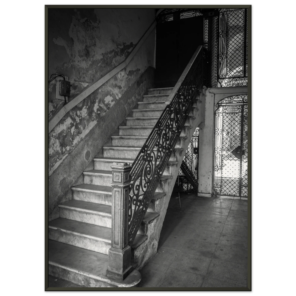 Elegant sweeping staircase inside a historic vintage building in Havana, Cuba - Fine art photography print by Paulo Côrte-Real